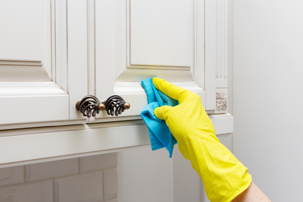 What is the best way to clean the interior of cabinets